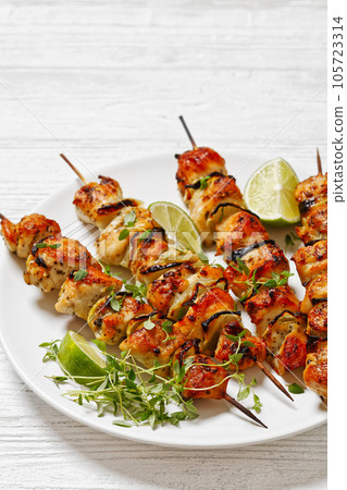 chicken souvlaki with thyme and lime on plate chicken souvlaki with thyme and lime on plate 105723314