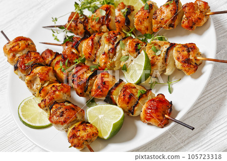 chicken souvlaki with thyme and lime on plate chicken souvlaki with thyme and lime on plate 105723318