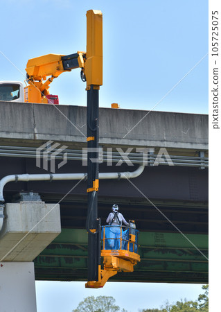 Road bridge inspection work scene with a bridge inspection vehicle Road bridge inspection work scene with a bridge inspection vehicle 105725075