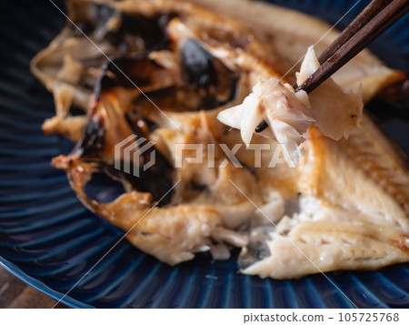 Open the throat black and dry it overnight. Grilled fish flakes. Close-up. 105725768