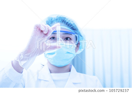Person doing the test Young researcher experimenting Researcher using a micropipette Science image Image material Person doing the test Young researcher experimenting Researcher using a micropipette Science image Image material 105729237