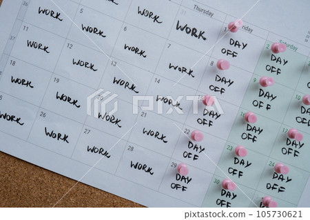 4 day work week printed calendar with pink pins on three days off in week weekend days four day working week concept. Modern approach doing business short workweek. Effectiveness of employees 4 day work week printed calendar with pink pins on three days off in week weekend days four day working week concept. Modern approach doing business short workweek. Effectiveness of employees 105730621