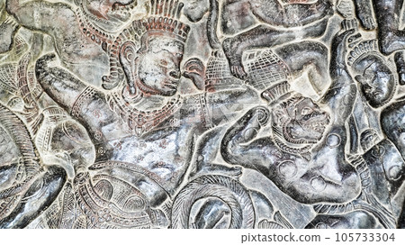 Wall carving of Khmer Culture in Ancient ruins Angkor Wat temple - famous Cambodian landmark. Siem Reap, Cambodia. Wall carving of Khmer Culture in Ancient ruins Angkor Wat temple - famous Cambodian landmark. Siem Reap, Cambodia. 105733304