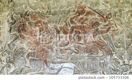 Wall carving of Khmer Culture in Ancient ruins Angkor Wat temple - famous Cambodian landmark. Siem Reap, Cambodia. Wall carving of Khmer Culture in Ancient ruins Angkor Wat temple - famous Cambodian landmark. Siem Reap, Cambodia. 105733306