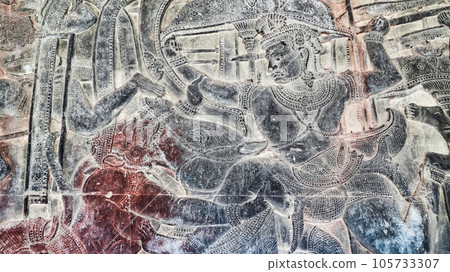 Wall carving of Khmer Culture in Ancient ruins Angkor Wat temple - famous Cambodian landmark. Siem Reap, Cambodia. Wall carving of Khmer Culture in Ancient ruins Angkor Wat temple - famous Cambodian landmark. Siem Reap, Cambodia. 105733307