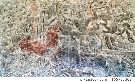Wall carving of Khmer Culture in Ancient ruins Angkor Wat temple - famous Cambodian landmark. Siem Reap, Cambodia. Wall carving of Khmer Culture in Ancient ruins Angkor Wat temple - famous Cambodian landmark. Siem Reap, Cambodia. 105733308