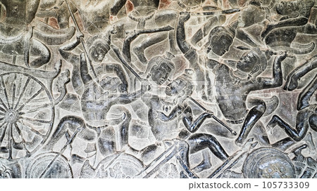 Wall carving of Khmer Culture in Ancient ruins Angkor Wat temple - famous Cambodian landmark. Siem Reap, Cambodia. Wall carving of Khmer Culture in Ancient ruins Angkor Wat temple - famous Cambodian landmark. Siem Reap, Cambodia. 105733309