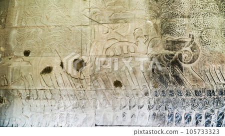 Wall carving of Khmer Culture in Ancient ruins Angkor Wat temple - famous Cambodian landmark. Siem Reap, Cambodia. 105733323