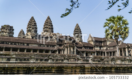Ancient ruins Angkor Wat temple - famous Cambodian landmark. Siem Reap, Cambodia. Ancient ruins Angkor Wat temple - famous Cambodian landmark. Siem Reap, Cambodia. 105733332
