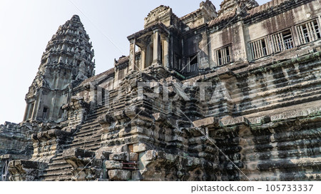 Ancient ruins Angkor Wat temple - famous Cambodian landmark. Siem Reap, Cambodia. Ancient ruins Angkor Wat temple - famous Cambodian landmark. Siem Reap, Cambodia. 105733337