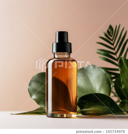 Reusable dark amber glass bottle for oil, cream, lotion or serum with leaves. Reusable dark amber glass bottle for oil, cream, lotion or serum with leaves. 105734970