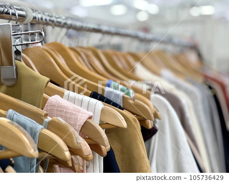 Summer clothes displayed on hangers 105736429