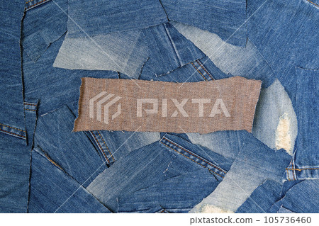 Denim upcycle. Circular economy. Pile of jean scrap with copy space. Denim upcycle. Circular economy. Pile of jean scrap with copy space. 105736460