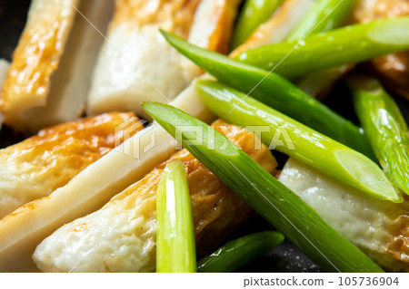 Stir-fried chikuwa and garlic sprouts, cooking scene. Stir-fried chikuwa and garlic sprouts, cooking scene. 105736904