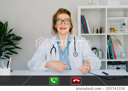 Headshot of middle aged female doctor talking with client online on computer, female nurse talking to sick patient on video call, using laptop. Telemedicine concept. Online remote medical appointment 105741356