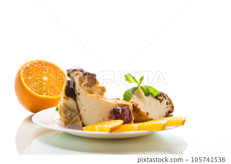 Sweet curd casserole with fruits in a plate Sweet curd casserole with fruits in a plate 105741536