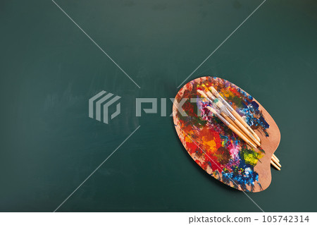 Back to art school. Painting courses. Art palette on chalkboard. Back to art school. Painting courses. Art palette on chalkboard. 105742314