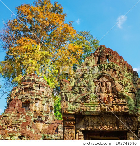 Intricate carvings embellishing the walls of an ancient Khmer structure. Intricate carvings embellishing the walls of an ancient Khmer structure. 105742586