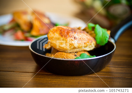 fried pieces of chicken fillet in a pan 105743271