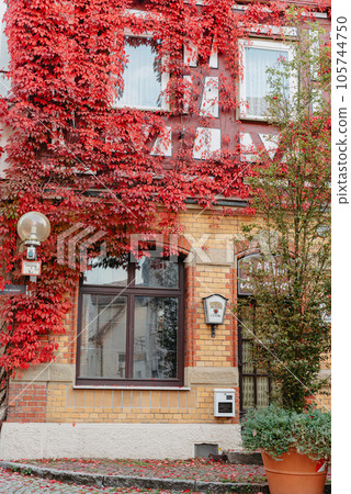 The Old Fachwerk houses in Germany. Scenic view of ancient medieval urban street architecture with half-timbered houses in the Old Town of Germany. 105744750