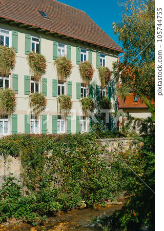 Old national German town house in Bietigheim-Bissingen, Baden-Wuerttemberg, Germany, Europe. Old Town is full of colorful and well preserved buildings. Old national German town house in Bietigheim-Bissingen, Baden-Wuerttemberg, Germany, Europe. Old Town is full of colorful and well preserved buildings. 105744755