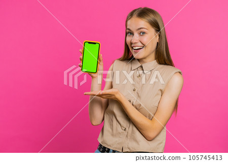 Developer woman girl hold smartphone with green screen chroma key mock up recommend good application 105745413