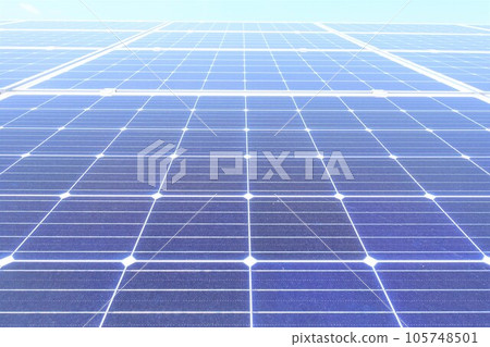 Monocrystalline solar panels lined up under a clear blue sky Monocrystalline solar panels lined up under a clear blue sky 105748501
