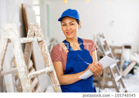 Woman construction worker with project documentation Woman construction worker with project documentation 105748545