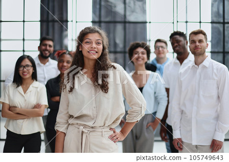 happy team of diverse corporate employees in the office lobby. happy team of diverse corporate employees in the office lobby. 105749643