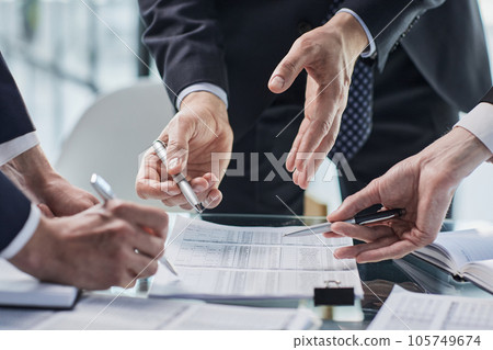 men close-up, looking in a folder with documents 105749674