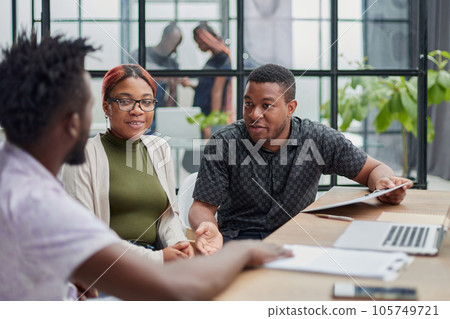In a modern office. a diverse team of managers at a company meeting to discuss business projects. 105749721