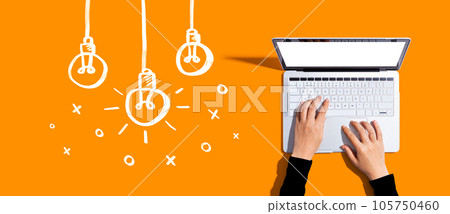 Hanging idea light bulbs with laptop computer Hanging idea light bulbs with laptop computer 105750460