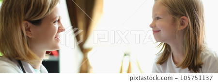 Doctor makes ultrasound diagnostic of girl patient in medical clinic. 105751137