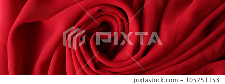 Red swirled fabric as background. 105751153