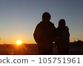 A couple looking at the sunset 105751961