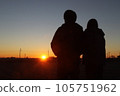 Silhouette of a couple watching the sunset 105751962