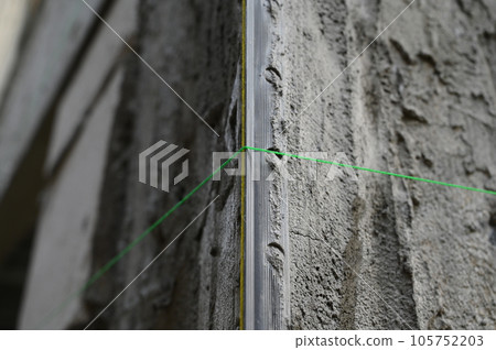 cement plaster texture background with green thread 105752203