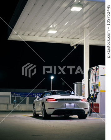 Porsche 718 Boxster at the gas station at night 105752448