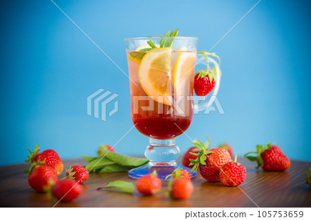 refreshing cool strawberry lemonade with lemon, ice and mint in a glass refreshing cool strawberry lemonade with lemon, ice and mint in a glass 105753659