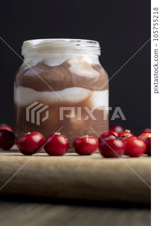 Yogurt with plum jam in a jar 105755218