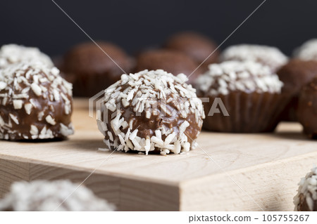 Chocolates with coconut sweet filling 105755267