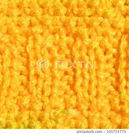 Handmade knitted fabric yellow wool background texture 105755773