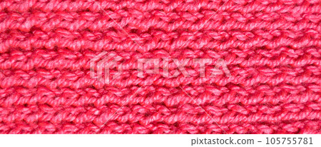 Handmade knitted fabric pink and red wool background texture Handmade knitted fabric pink and red wool background texture 105755781