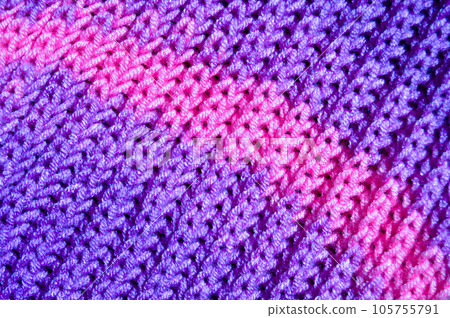 Handmade knitted fabric purple wool background texture 105755791