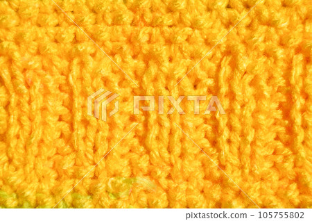 Handmade knitted fabric yellow wool background texture Handmade knitted fabric yellow wool background texture 105755802
