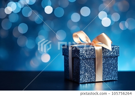Blue Gift Box with Glitter Lights and Bokeh Blue Gift Box with Glitter Lights and Bokeh 105756264