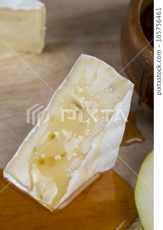 delicious soft cheese with white mold close-up 105756461