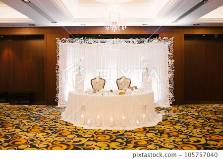 Wedding table for the bride and groom in a classic restaurant Wedding table for the bride and groom in a classic restaurant 105757040