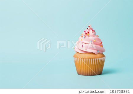 Freshly made cupcake with whipped cream on a delicate pastel background. Minimalism. Freshly made cupcake with whipped cream on a delicate pastel background. Minimalism. 105758881