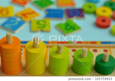 Math game for children. Natural materials, wooden. Score, number composition. Home education concept, early development, skills. Daylight. Outside. 105759933